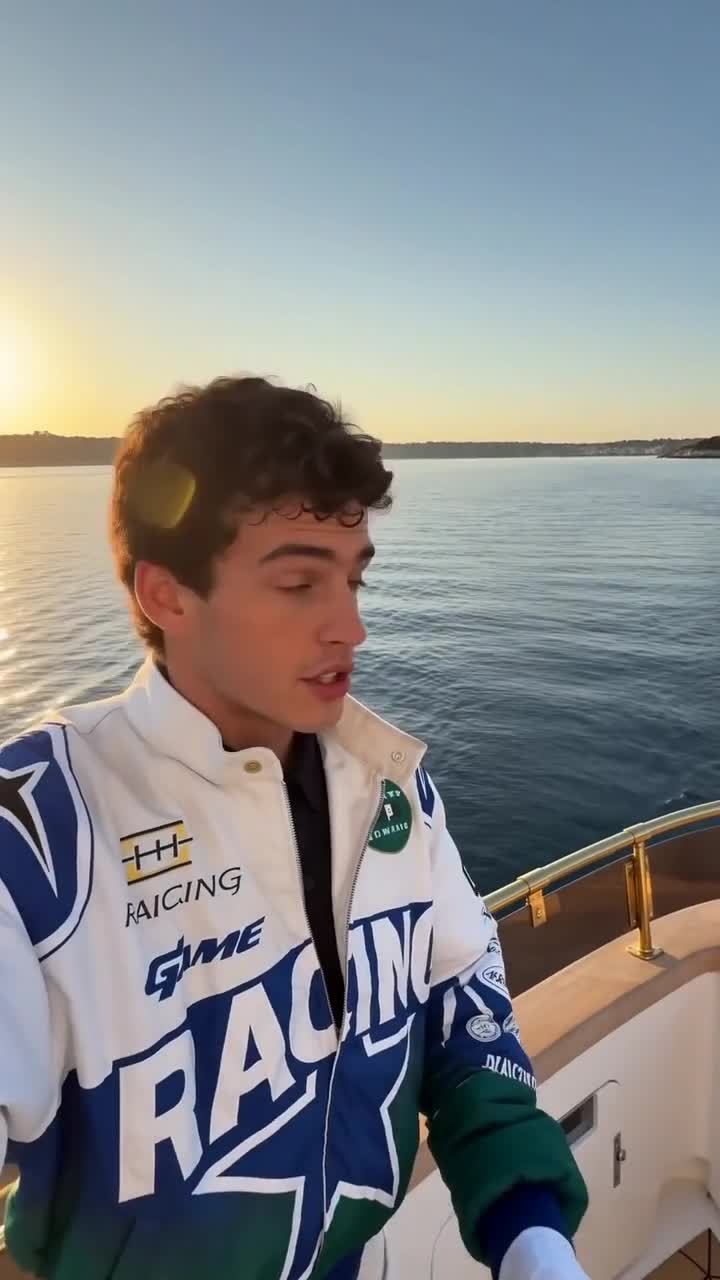 Creator filming a selfie-style video aboard a boat at sunset talking about the SlipSafe grip